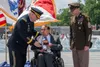 Army Daniel A. Dailey, right, present former Sen. Bob Dole a wooden box with colonel rank in it during a honorary promotion ceremony at the World War II Memorial in Washington, D.C., May 16, 