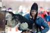 ROBERT DeBERRY/Frontiersman Lance Mackey unloads a dog at the
restart of the 38th Iditarod Trail Sled Dog Race in Willow Sunday
March 7. Mackey is in the lead with a two hour lead of Jeff
Kin