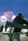 ROBERT DeBERRY/Frontiersman Nick Larrison and Courtney Gabel
watch the fireworks display at the Alaska State Fair.