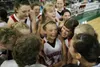 ROBERT DeBERRY/Frontiersman Leisl Brown, center, is surrounded
by her Warrior team mates after beating Dimond 44-43 to advance to
the final game at the First National Bank/ASAA 4A State Baske