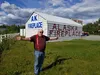 Dan Michaud, owner of Alaska Fireplace and Accessories who is popularly known in the community as “Dan the Fireplace Man,” extends his arms at different directions of his property along the P