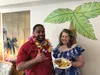 Basa Faletagoa’I, the resident engagement coordinator with Cook Inlet Housing Authority, hangs loose with Angelia Stanley, a resident at the Coronado Park Senior Village, in Eagle River durin