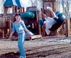 Veroniuca Henriksen, left, and Courtney Gabel play on the tire
swing in the A-Moose-Ment playground.WILLIAM WOODY/Frontiersman