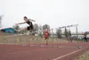 Houston Hawk Ben Bayne holds his lead in the 300-meter hurdle event to take first place during Saturday's finals at the Region III Track and Field Championships at Palmer High School. ROBERT 
