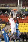 Wasilla senior Connor Devine dunks on the Bartlett Golden Bears during a victory in the 4A third-place game Saturday at the Sullivan Arena in Anchorage. Devine finished with 27 points and 20 