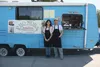 Noy Phetphommasouk, right, and his 14-year-old daughter Noralee pose for a photo outside their Lao and Thai food truck, Pho Nora, in Palmer on Friday, May 13. Phetphommasouk also owns Pho Vat