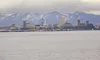The Anchorage skyline is visible across the Knik Arm of Cook Inlet. The Knik Arm Bridge and Toll Authority hopes to construct a toll bridge from Anchorage to Point MacKenzie. A bill passed th