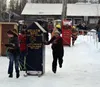 Willow Winter Carnival participants race their handmade outhouses during the 2019 Outhouse Race. File photo