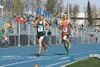 Colony freshman Sam Deering sprints past an Anchorage Christian School runner at the finish line of the 1,600-meter run during last weekend’s Palmer Invitational and Relays. Deering placed se