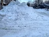A large pile of snow sits in the yard of a Palmer neighborhood following the recent windstorms. Jeremiah Bartz/Frontiersman