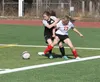 Colony's Annie Kessler tries to keep the ball away from Wasilla's Jodie Richie in the right corner of the field in Colony's defensive end. Wasilla beat Colony 7-0 in the match. Jeremiah Bartz