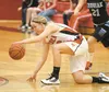 Wasilla senior guard Alexis Imoe scrambles to recover the ball during the first period of  Wasilla’s win over the Chugiak Mustangs Thursday at the Doc Larson’s Roundball Classic at Wasilla Hi