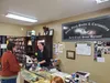 Taylor Jordan attends to a customer at the new Black Birch Books location off Bogard Road.