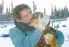 Todd Disher/ Frontiersman First time Iditarod musher Lou Packer
kisses one of his dogs before heading out on a training run
Thursday morning near Willow.