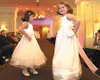 Sisters Alexis and Raylee Moore model dresses during Donna
Turner's 13th annual Bridal Spectacular. She owns Donna's Corner on
South Big Lake Road. Photo by Dave Harbour