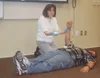 DEBRA McGHAN/Courtesy photo Palmer Middle School nurse Cathy
Voran demonstrates a technique on Joe Sylvia at a recent Teen
Community Emergency Response Team training.
