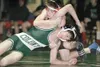 ROBERT DeBERRY/Frontiersman Colony freshman Noah Roetman tries
to escape from Wasilla'€™s Conner Minnick during a dual Thursday
afternoon at Colony High School.