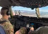 U.S. Air Force Capt. Rob Mello, left, a C-17 pilot with the 517th Airlift Squadron, and U.S. Air Force Capt. Ben Aiken, the 517th AS Weapons and Tactics Flight commander and weapons officer, 