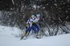 Alaska Nordic Racing teammates Emily Walsh and Claire Nelson push each other up the final hill in the women's interval-start 5-kilometer freestyle at Government Peak Recreation Area on Sunday