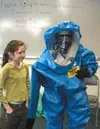 Caroline Roy with PRISM HazMat Handling displays some of the
clothing used by hazardous materials specialists with help from
Kelly Roy. Photo by DANIEL SPOTH/Frontiersman.