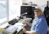 Wolfgang Winter prepares to call the starting lineups prior to a
Mat-Su Miners game Tuesday at Hermon Brothers Field in Palmer.
Winter, who’s also Palmer High School principal, has served as 