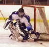 Kyle Berti pushes the puck away from the Palmer net for the
Moose in Palmer's 5-1 loss to West Wednesday. Photo by JEREMIAH
BARTZ/ Frontiersman.