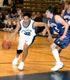 Palmer senior Stanley Ratcliff drives toward the basket during
Palmer's 56-34 win over Skyview on Saturday. Photo by JEREMIAH
BARTZ/ Frontiersman.