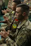 4. Soldiers from the United States and People’s Liberation Army China sit side-by-side during the opening ceremony of the China Disaster Management Exchange held Nov. 13-18.The DME is an annu
