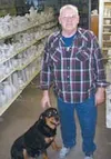 Harvey "Bud" Longenecker and his Rottweiler will concentrate on
operating Knik Knack Mud Shack following Longenecker's retirement
from the Alaska State Fair. Photo by STEVE KADEL/Frontiersman