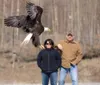 ROBERT DeBERRY/Frontiersman Spectators watch as a bald eagle is
released into the wild after being rescued and nursed back to good
health by the Alaska Wild Bird Rehabilitation Center in
Hous