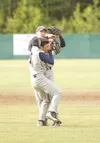 JEREMIAH BARTZ/Frontiersman Alaska second baseman Chris Breck,
right, tags Zach Peek after the Fairbanks base runner tried to get
back to second base. With Peek standing several feet off the 