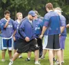 Palmer offensive line coach Tim Popowski, center, works with a
group of linemen during a Palmer practice earlier this year. The
Moose open the season today against South Anchorage at Anchorag