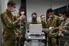 New Jersey National Guard combat medic specialists with Joint Task Force-57 (JTF-57), test an electrocardiogram at the Meadowlands Exposition Center, Secaucus, N.J., April 6, 2020. The New Je