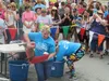 A competitor in the Bear Paw’s Slippery Salmon Olympics grabs a fish and heads toward the obstacles. Gretchen Vehmhoff