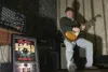 Former rocker Doug Theiner, owner of the Rock Shop in Willow,
has a past playing lead guitar for Ravage, a heavy metal band out
of Chicago. The album cover of Ravage's only record sits to the