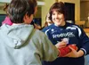 O’Hara Shipe signs a student’s cast while visiting Teeland Middle School April 17. Courtesy Catherine Esary/Mat-Su Borough School District