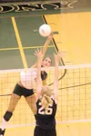 MATT TUNSETH/Frontiersman Colony senior Hannah Curtis goes up
for a spike Thursday during Colony’s three-game win over North Pole
at Colony High School. Curtis led all players with 12 kills i