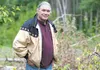 Chickaloon-area resident Charles Lone Wolf stands near his property on East Chickaloon Road. Wolf is defending himself in a lawsuit brought by the state over right of way to access the road. 