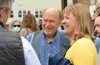 Bill Walker, independent candidate for Alaska governor, talks with a voter alongside his lieutenant governor candidate, Heidi Drygas, on Wednesday, June 8, 2022 in Juneau, Alaska. James Brook