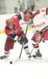 Wasilla forward Jade Johnston faces off against West Valley’s
Logan Wendling during Friday’s game at the ASAA/First National Cup
State Hockey Tournament in Wasilla. ROBERT DeBERRY/Frontiersma