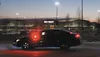 A police car with red lights flashing is positioned in the middle of Seward Meridian Parkway in front of Wal-Mart Thursday evening. The road south of the Parks Highway was closed off and acce