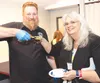Chef Jason Parsons, of Big J’s BBQ, poses with his winning dish at last year’s Taste of Hope competition. Joy Fearn-Condon, American Cancer Society executive committee member, is next to him.