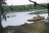 The Stickleback, a scow Joe Redington built, and the Nomad at
Flat Horn Lake. Drive along Knik-Goose Bay Road and just before the
Knik Bar the Nomad is visible in Cook Inlet. (Courtesy Reding