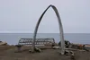 An arch made of whalebones, along with the frame of a traditional umiat, are displayed on the beach at Utqiagvik, the northernmost U.S. community. The landmarks are seen overlooking the open 