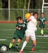 Colony senior captain Harrison Menard battles a South Anchorage player for the ball during a 5-0 loss to the Wolverines in the ASAA/First National Bank State Soccer Championships quarterfinal