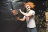 Houston High School's Scott Kramer weilds a chainsaw inside the
haunted house at Sportsman's Warehouse Saturday afternoon. (ROBERT
DeBERRY/Frontiersman) Robert DeBerry