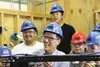 U.S. Secretary of Labor Thomas E. Perez laughs while taking a group Sunday with students in the electrical program at the Alaska Job Corps Center in Palmer. HEATHER A. RESZ/Frontiersman.com