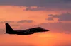 F-15 Eagle Military Jet in flight at sunset guvendemir