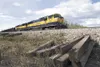 Piles of sed railroad ties sit along side the tracks Thursday
afternon. The Alaska Railroad is replacing about 50,000 ties in the
latestest installment of the tie replacement program. The use