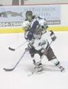 ROBERT DeBERRY/Frontiersman Colony Knights Rosy Fujimoto, front,
and Kyle Miller double team Soldotna Star Anton Olson during the
second period of Friday's game at the Curtis C. Menard II Mem